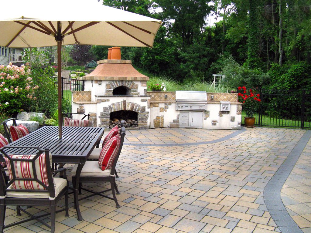 Outdoor living area with stone fireplace